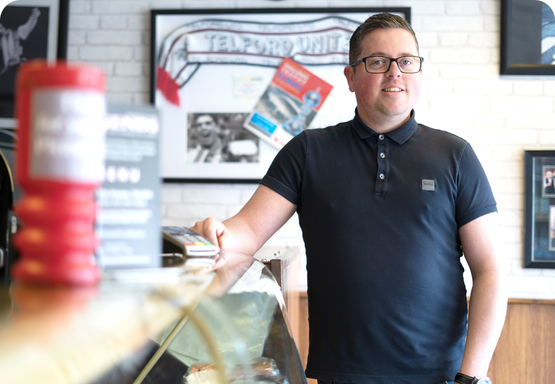 Simon from Legends stood in front of his counter